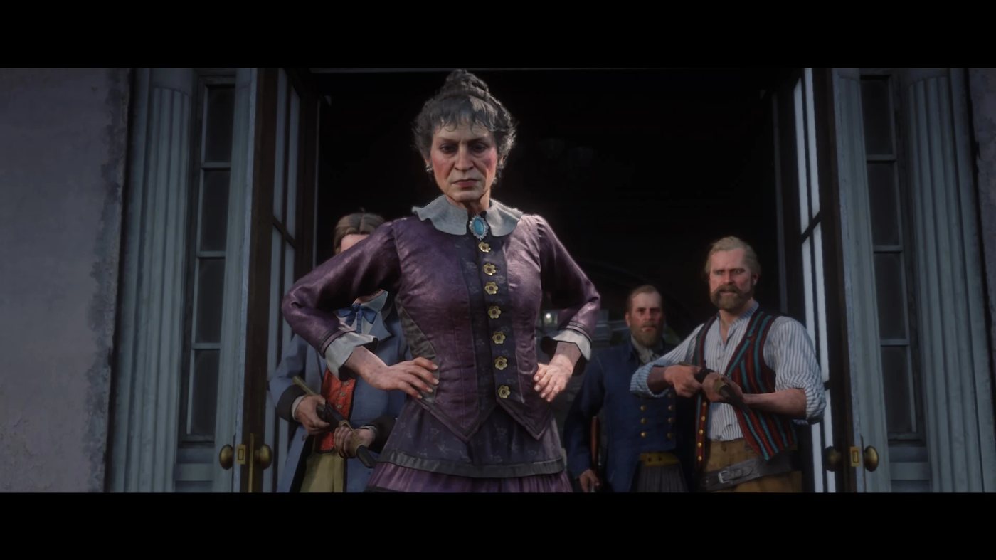 Catherine Braithwaite standing at her front door with armed men behind her