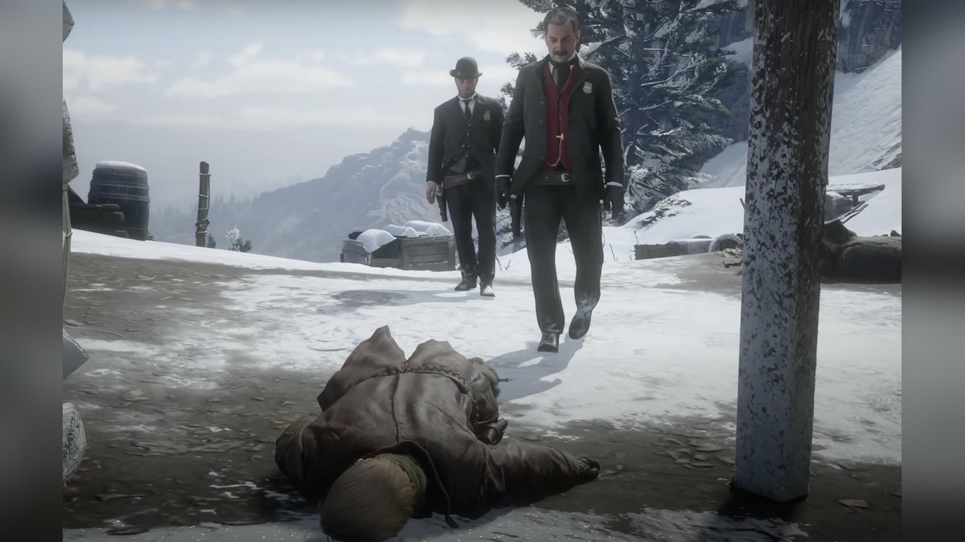 Two men walking towards a body in the snow