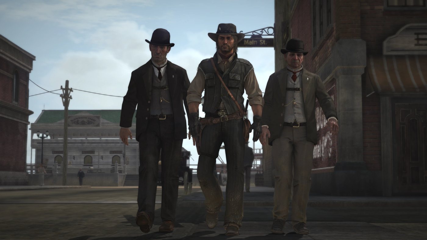 Three men walking in a town street