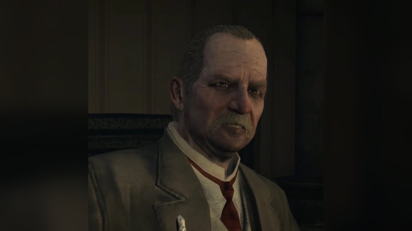 Close-up of Ross in a dark room