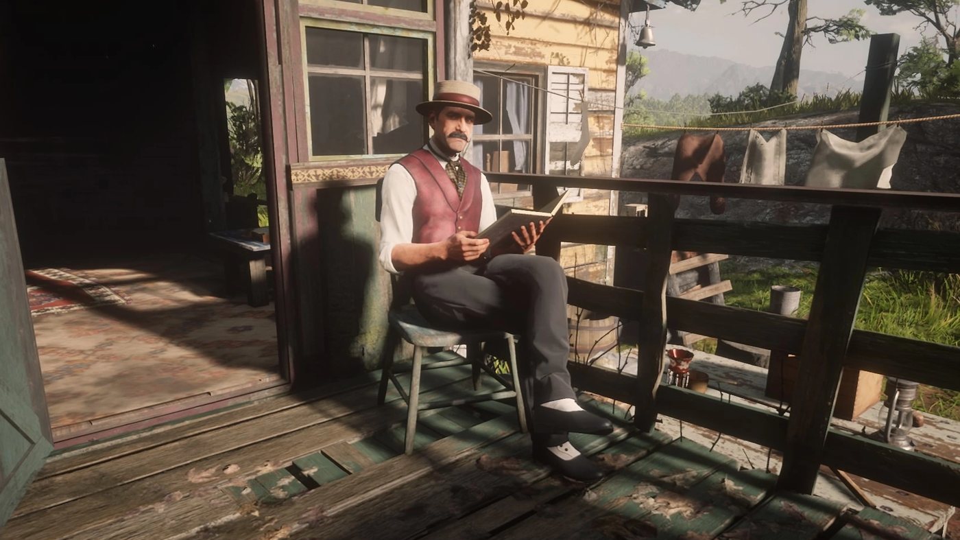 Trelawny reading on the porch of a caravan