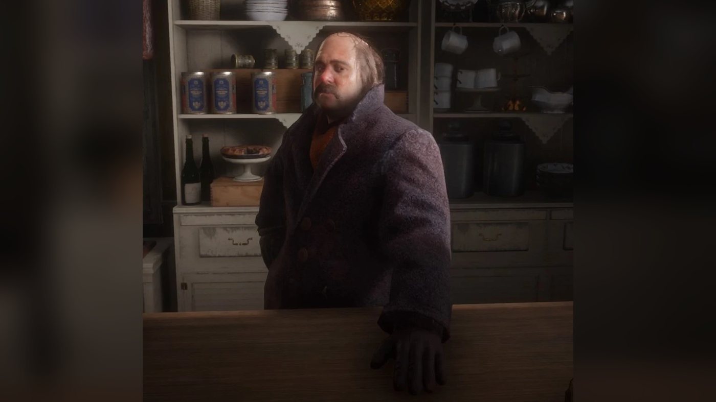 Pearson in a winter coat behind a store counter