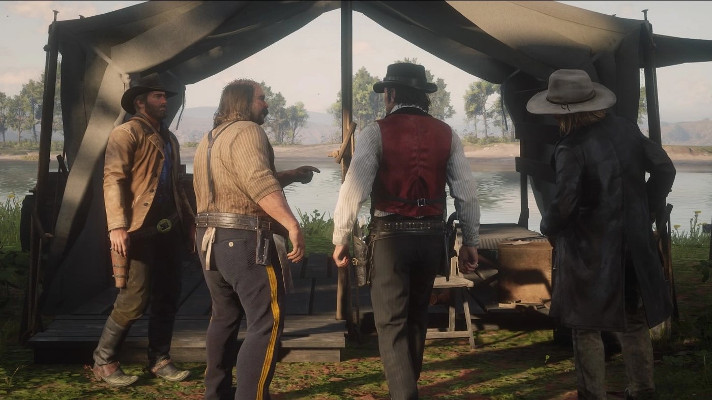 Pearson with Arthur, Dutch and Micah under a tent by the lake