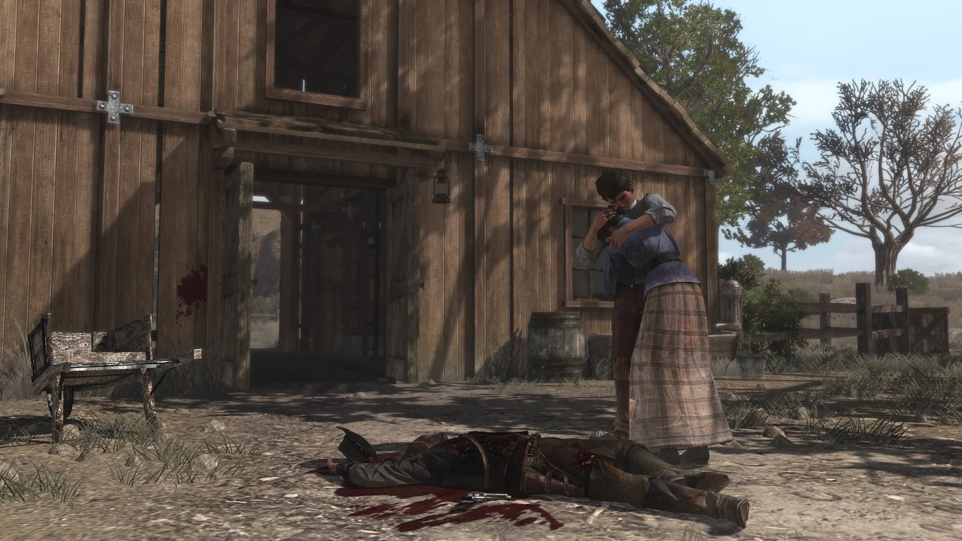 Abigail et Jack Marston près du corps de John devant la grange de Beecher's Hope